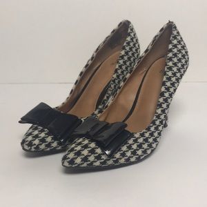 Black and White heels with a bow on front.